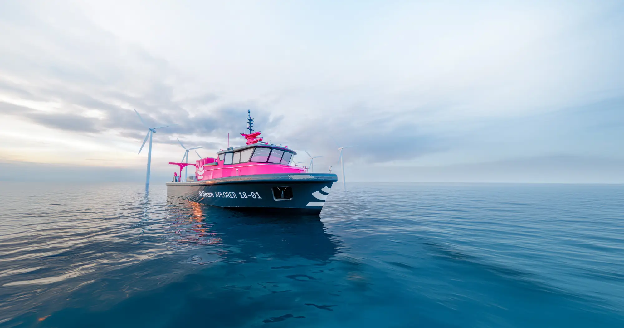 The pink vessel floats on a calm ocean surface, with wind turbines visible in the background, symbolizing the integration of renewable energy and cutting-edge marine technology.